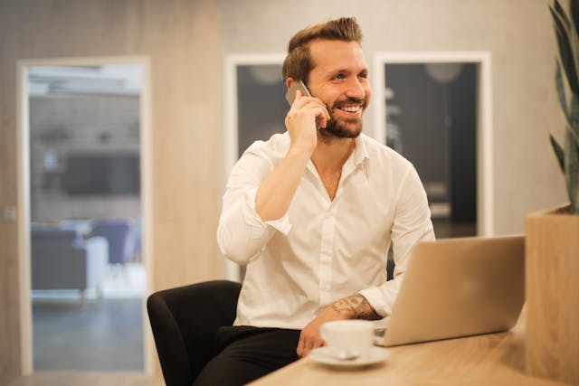 a%20property%20manager%20smiling%20while%20taking%20a%20phone%20call a%20property%20manager%20smiling%20while%20taking%20a%20phone%20call